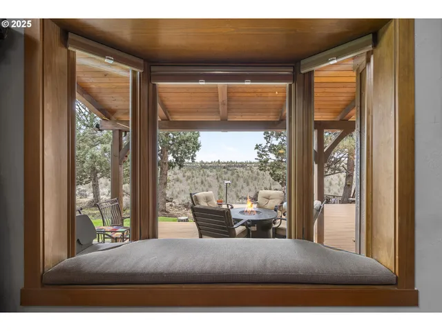 a room with stainless steel appliances kitchen island granite countertop a stove a sink and a refrigerator