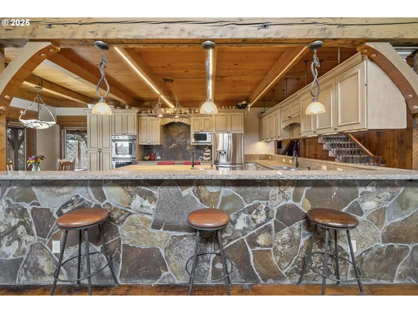 a kitchen with a sink and a mirror