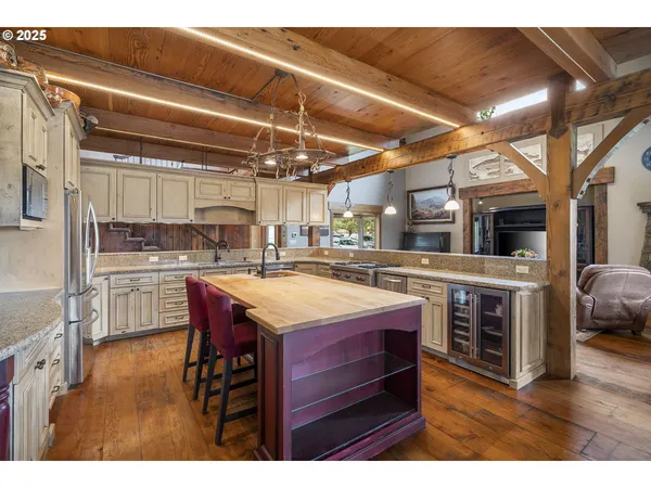 a view of a dining room with furniture wooden floor and chandelier