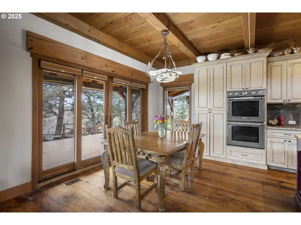 a balcony with wooden floor and fence