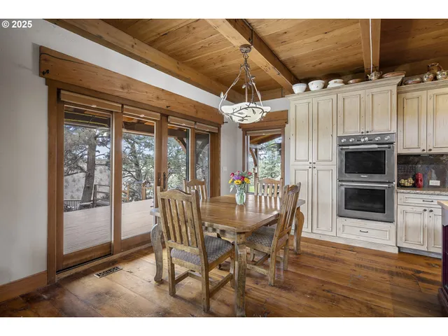a balcony with wooden floor and fence