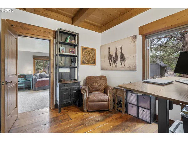 a bathroom with a sink double vanity granite tub shower and a mirror