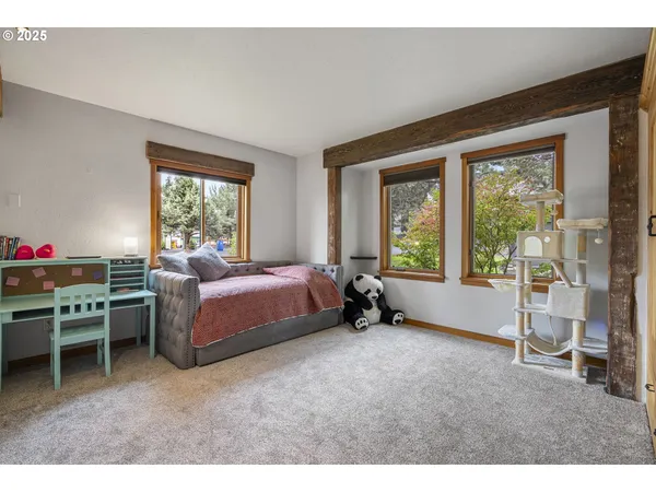 a bedroom with a large bed and a large window