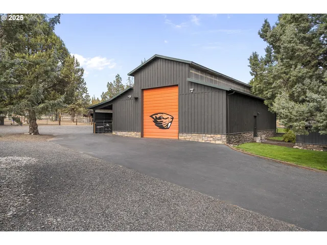 a kitchen with stainless steel appliances granite countertop a sink a microwave refrigerator and stove