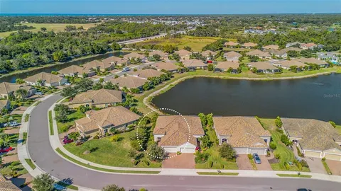 an aerial view of a house with a ocean view