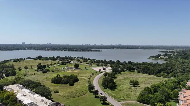 a view of a lake with houses in outdoor space