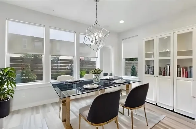 a view of a dining room with furniture window and wooden floor
