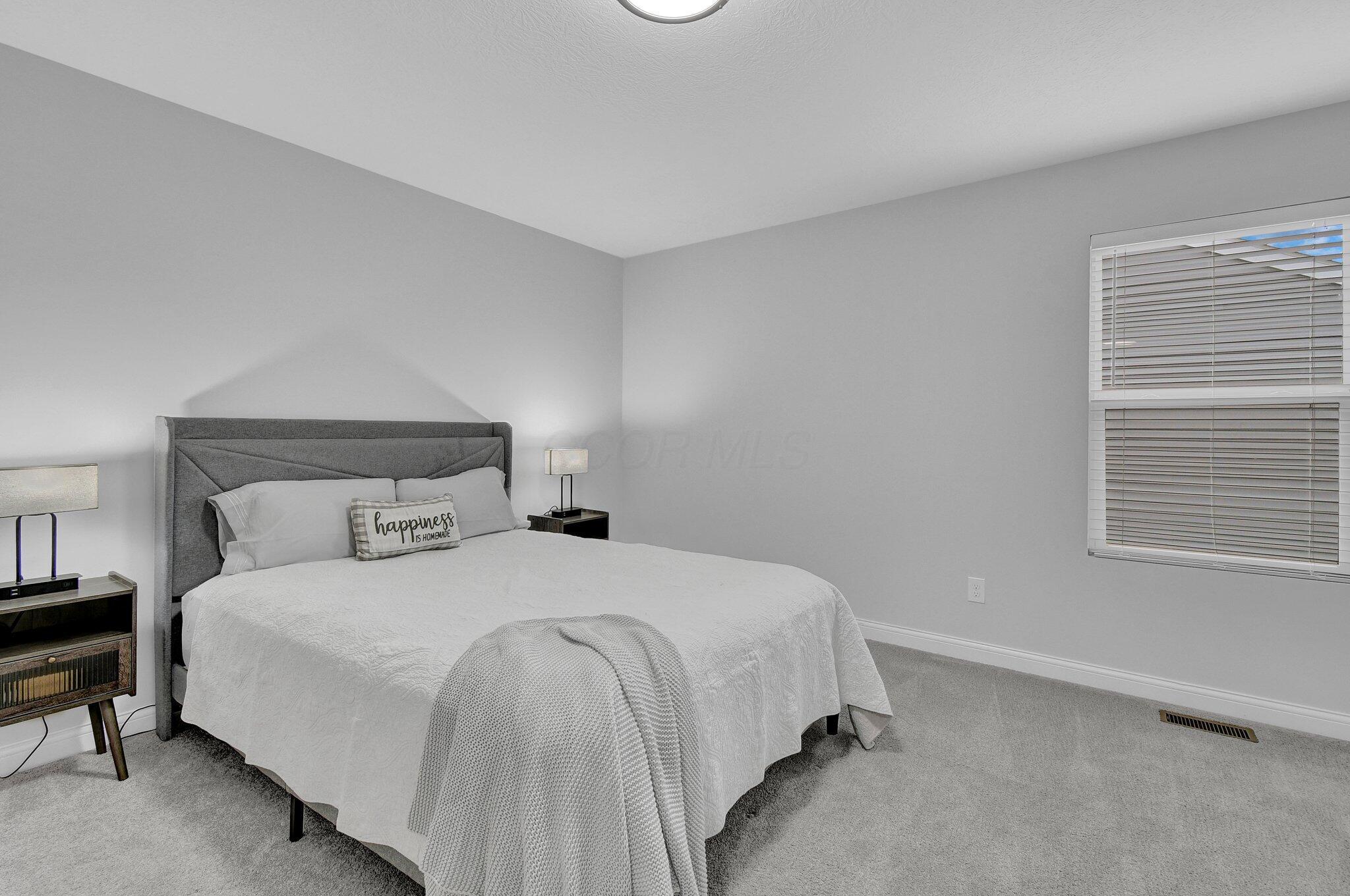 916 Rooks Circle Sunbury, OH 43074 - Photo 27 of 39 Bedroom #4 is generous with another large walk-in closet and neutral decor.