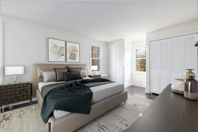 a bedroom with a bed and a couch