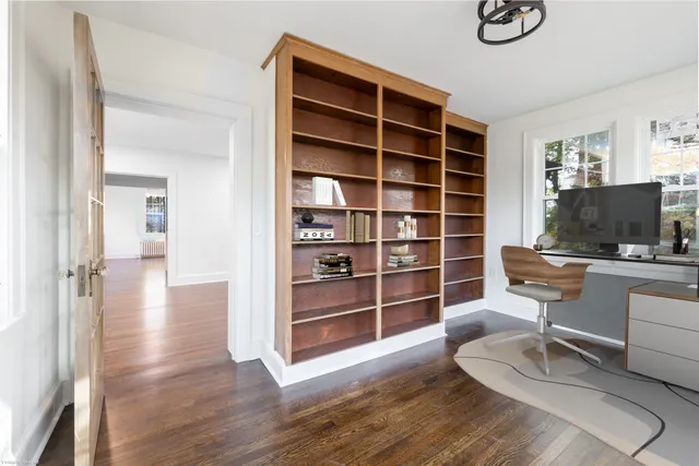 a view of a livingroom with furniture and wooden floor