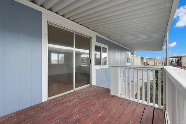 a view of hallway with wooden floor