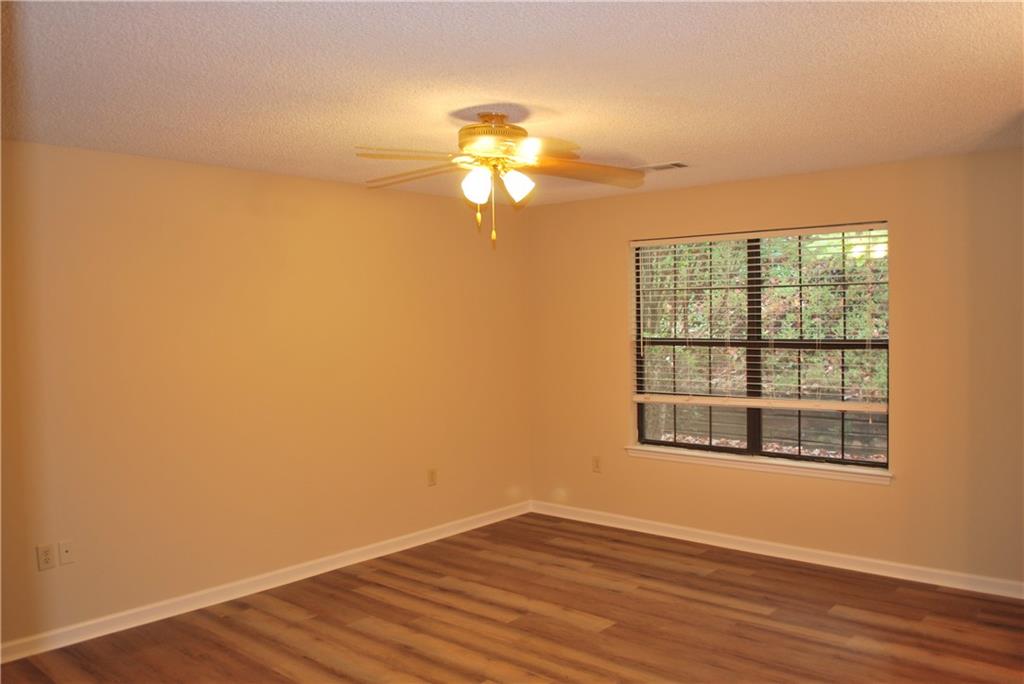 2235 Old Hamilton Place Gainesville, GA 30507 - Photo 1 of 12 a view of empty room with wooden floor and fan