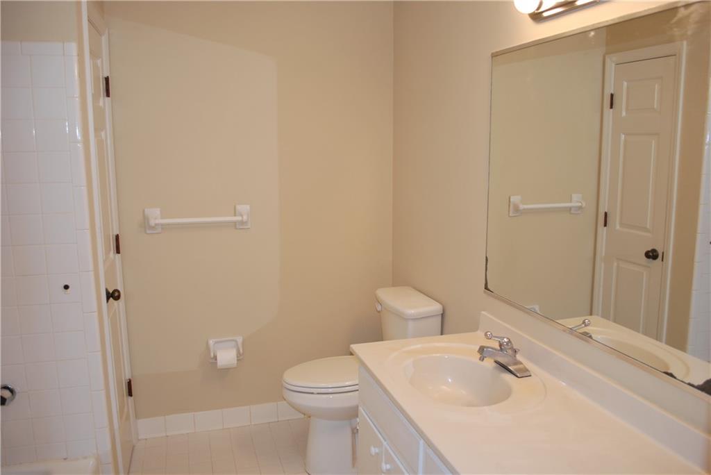 2235 Old Hamilton Place Gainesville, GA 30507 - Photo 9 of 12 a bathroom with a sink a toilet and shower