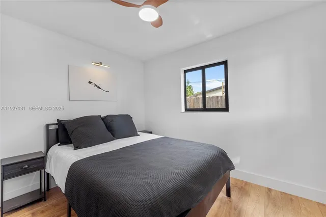 a bedroom with a bed and window