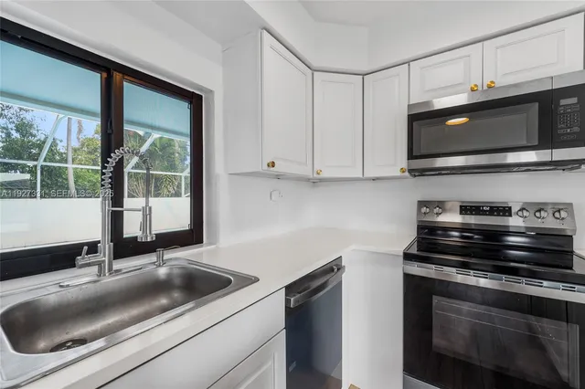 a kitchen with a stove and a microwave