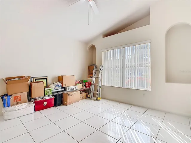 a bedroom with furniture and a book shelf