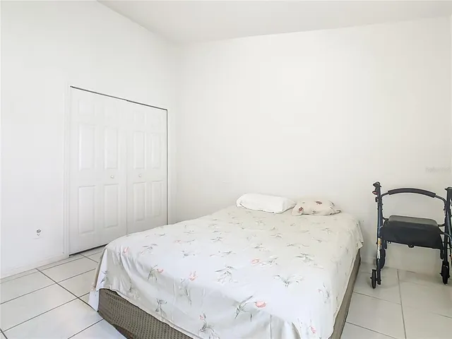 a bedroom with a bed and a dresser