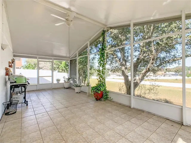 a view of a room with window and brick walls