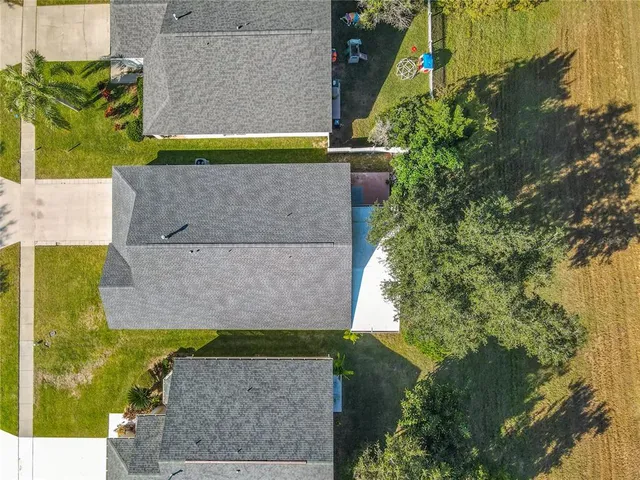 an aerial view of a house with a garden