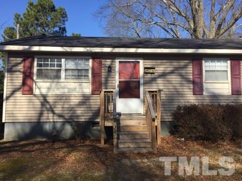 735 North Main Street Wake Forest, NC 27587 - Photo 1 of 5 a front view of a house with a yard