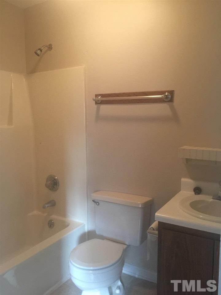 735 North Main Street Wake Forest, NC 27587 - Photo 4 of 5 a bathroom with a sink a toilet and bathtub