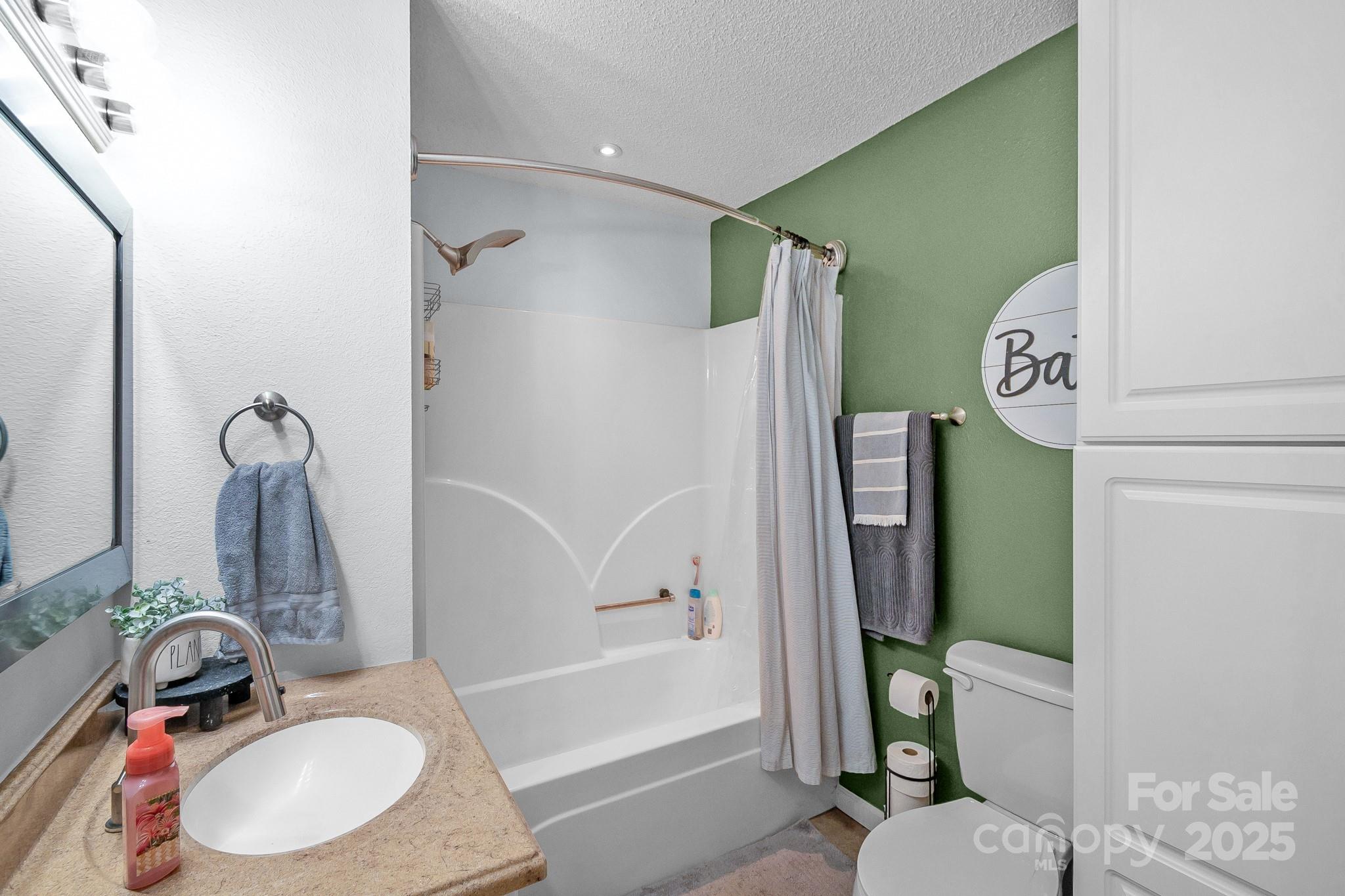 2578 Laboratory Road Lincolnton, NC 28092 - Photo 17 of 34 a bathroom with a sink toilet and shower