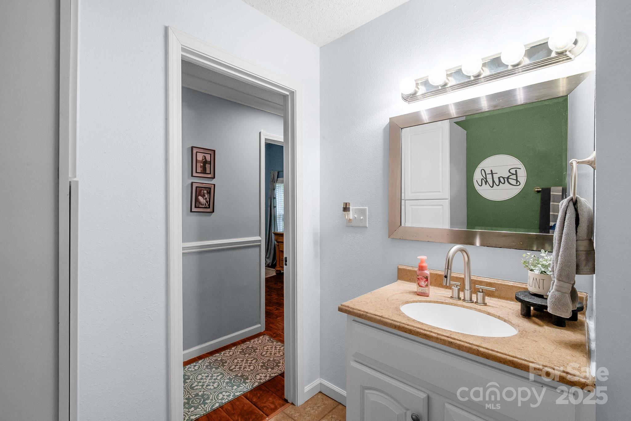 2578 Laboratory Road Lincolnton, NC 28092 - Photo 18 of 34 a bathroom with a granite countertop sink and a mirror