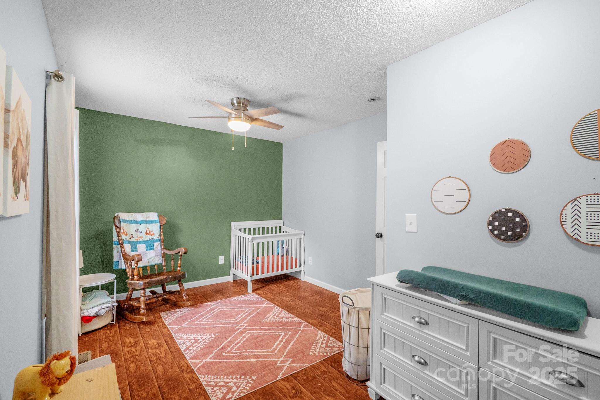 2578 Laboratory Road Lincolnton, NC 28092 - Photo 20 of 34 a bedroom with a bed and a chair in it