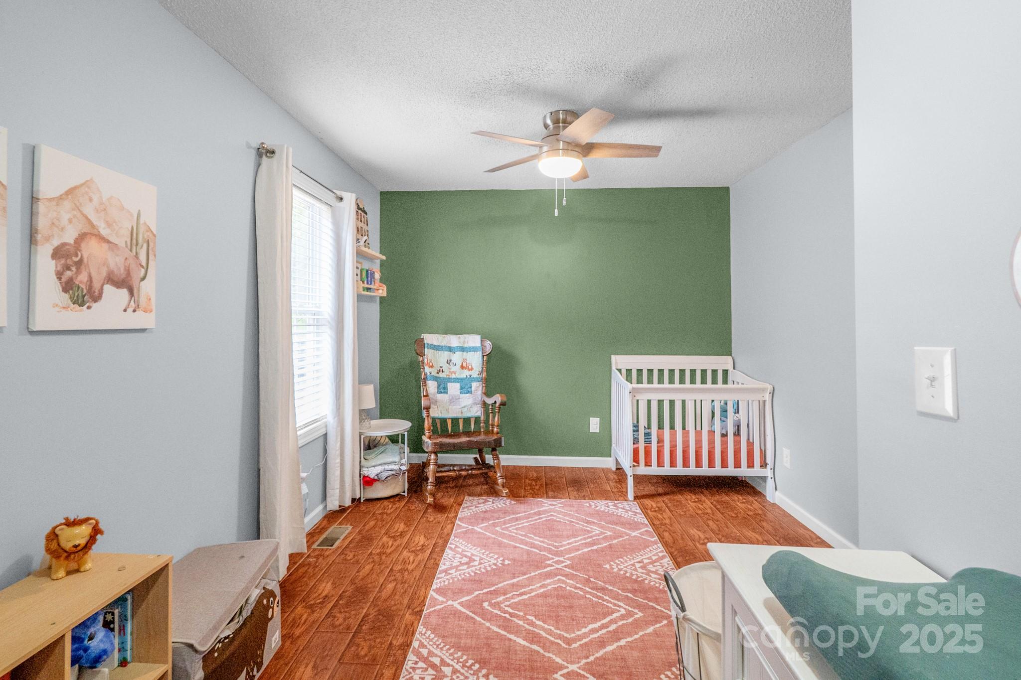 2578 Laboratory Road Lincolnton, NC 28092 - Photo 21 of 34 a bedroom with a bed and a chandelier