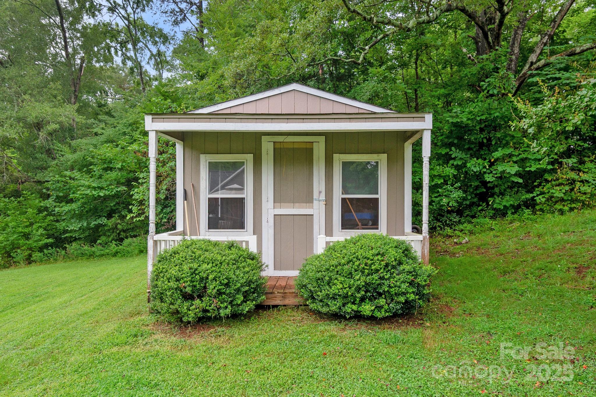 2578 Laboratory Road Lincolnton, NC 28092 - Photo 30 of 34 a view of a house with a yard plants and large tree