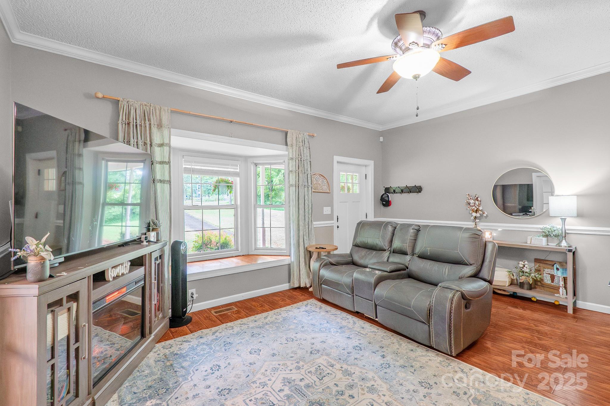 2578 Laboratory Road Lincolnton, NC 28092 - Photo 7 of 34 a living room with furniture and a fireplace