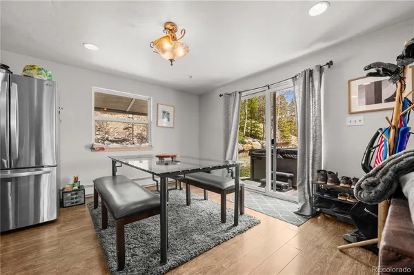 a view of a livingroom with furniture hardwood floor and a flat screen tv