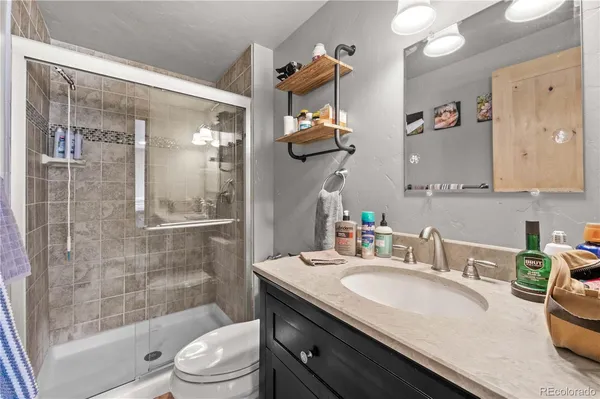a bathroom with a sink vanity and a mirror