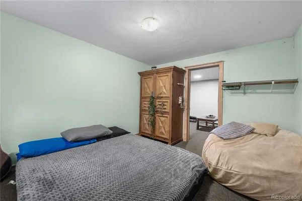 a bathroom with a double vanity sink toilet and shower