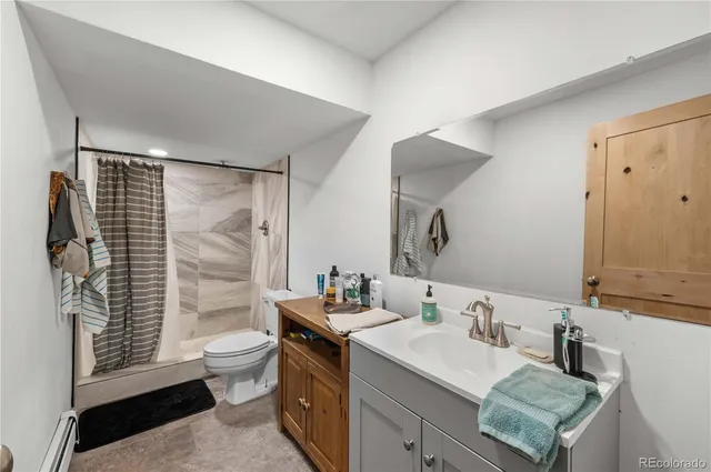 a bathroom with a sink toilet and vanity