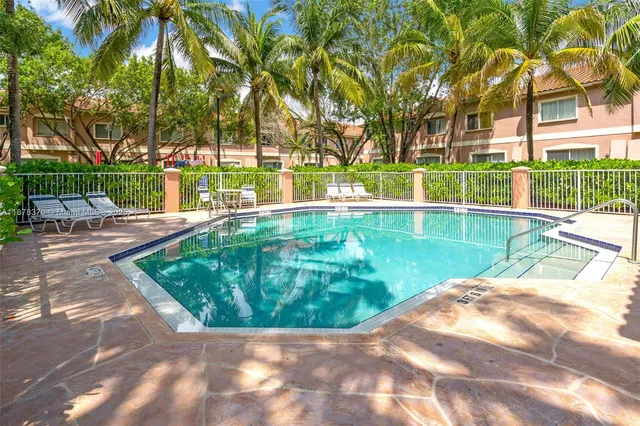 a view of a swimming pool with a patio