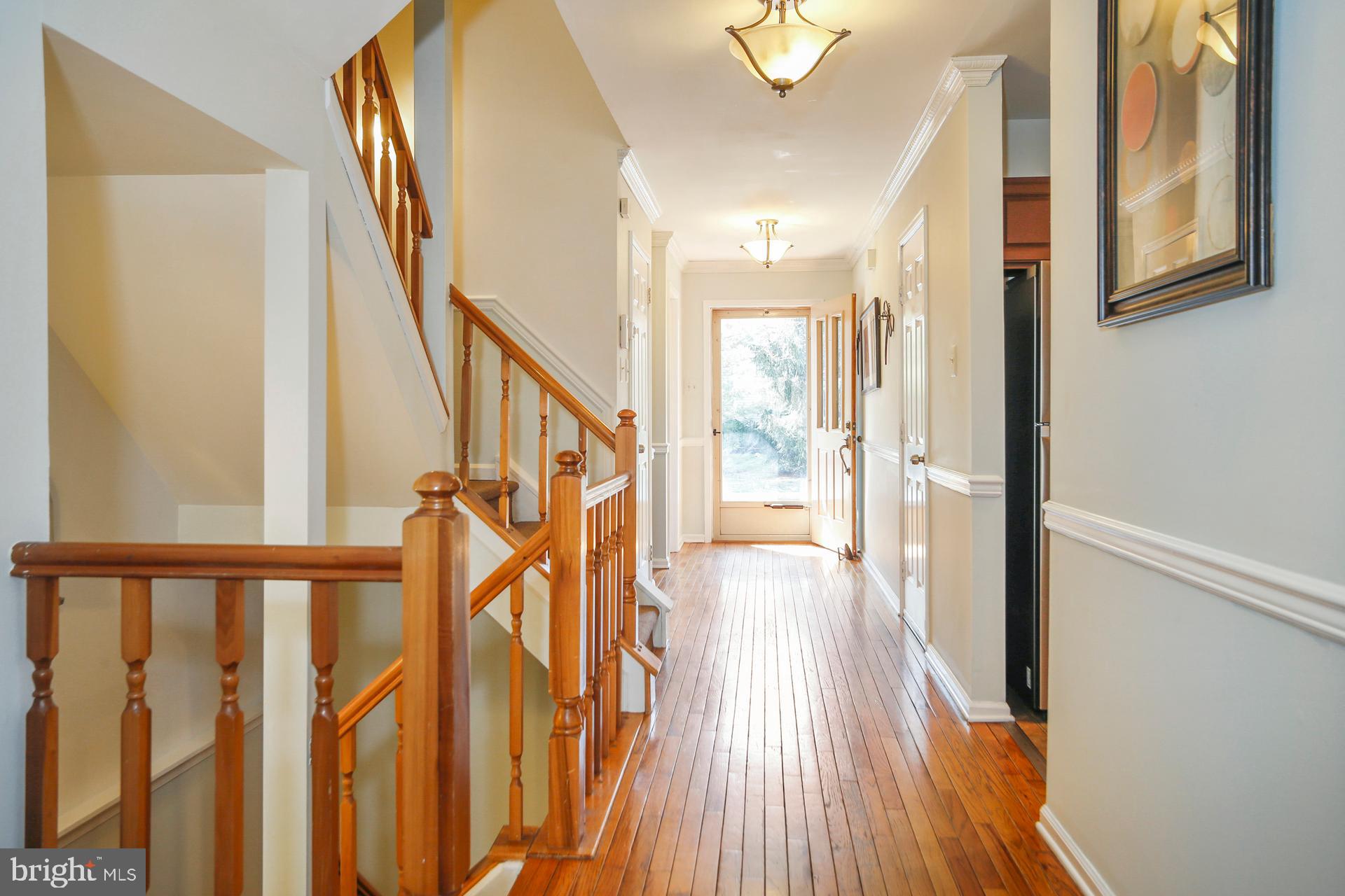 45 Main Street Chesterbrook, PA 19087 - Photo 11 of 36 a view of an entryway with wooden floor and stairs