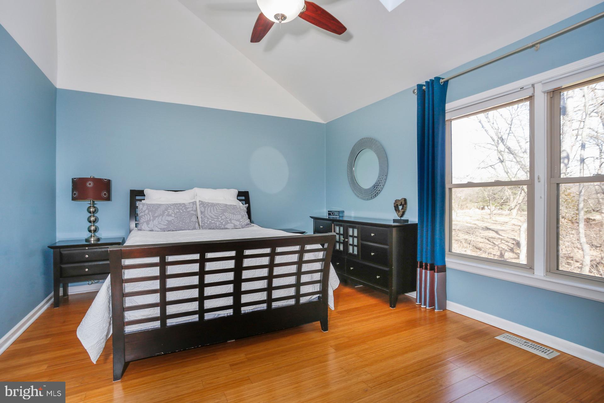 45 Main Street Chesterbrook, PA 19087 - Photo 16 of 36 a bedroom with a bed and wooden floor