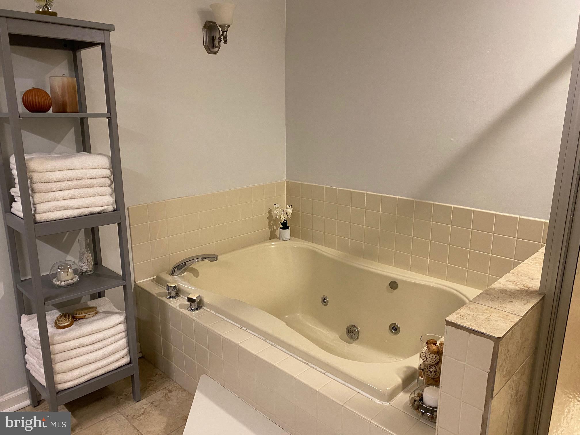 45 Main Street Chesterbrook, PA 19087 - Photo 19 of 36 a bathroom with a tub and a shower