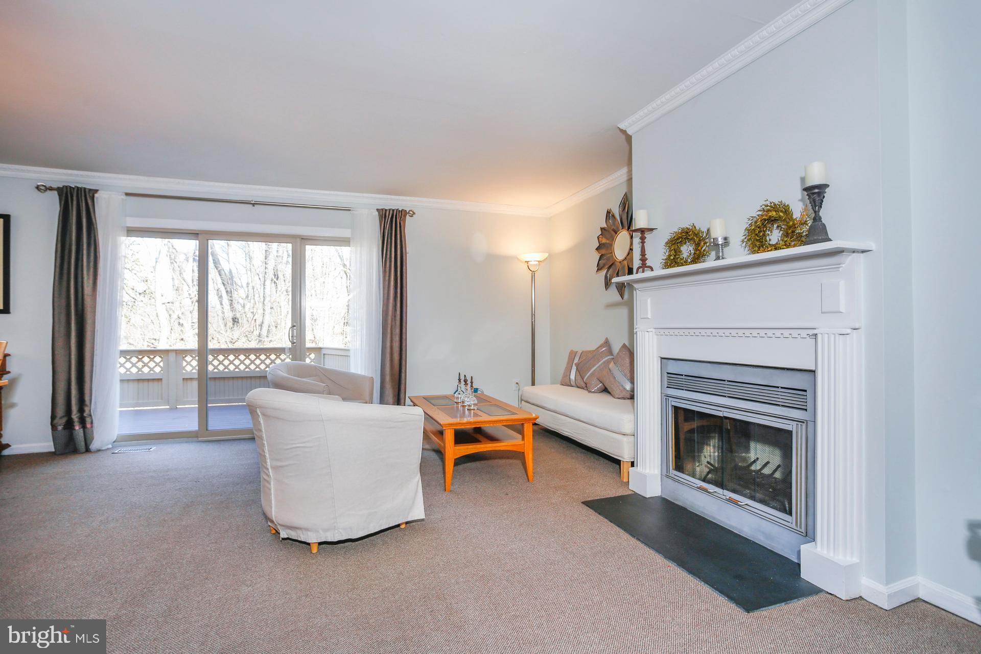 45 Main Street Chesterbrook, PA 19087 - Photo 4 of 36 a living room with furniture and a fireplace