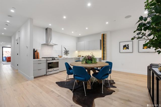 a view of kitchen with microwave and wooden floor