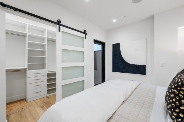 a bedroom with a bed and a dresser