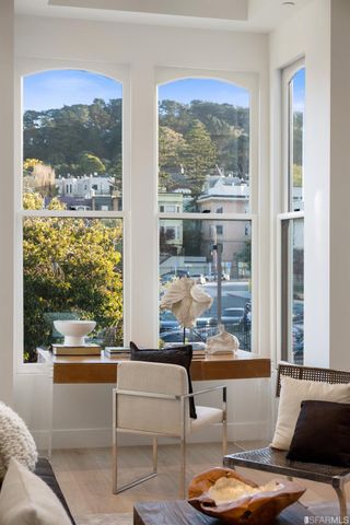 a living room with patio furniture and a window