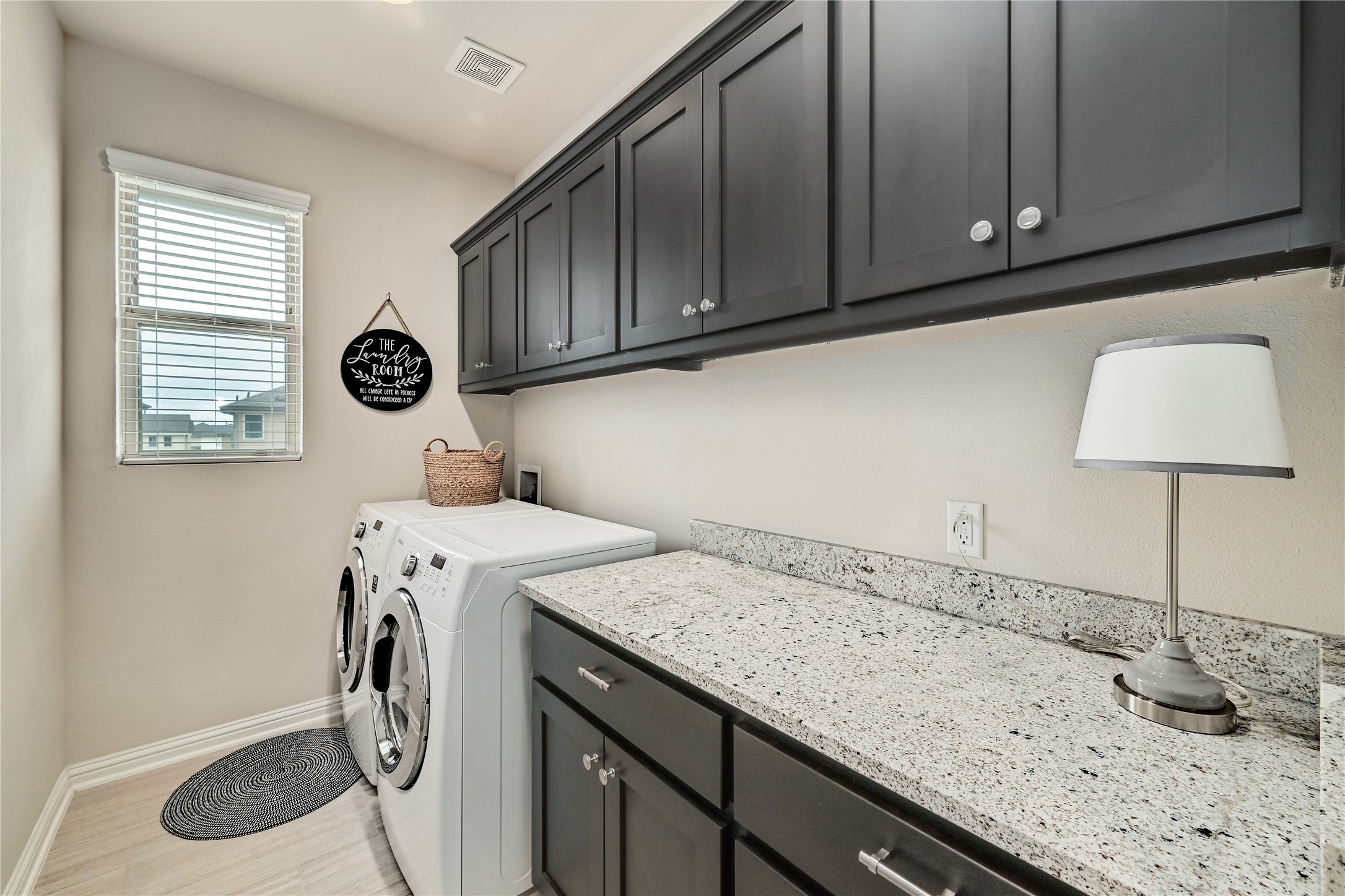 6814 East Riverside Drive, Unit 64 Austin, TX 78741 - Photo 17 of 17 Functional laundry space located on the second floor features ample cabinetry, generous granite counters, and modern appliances.