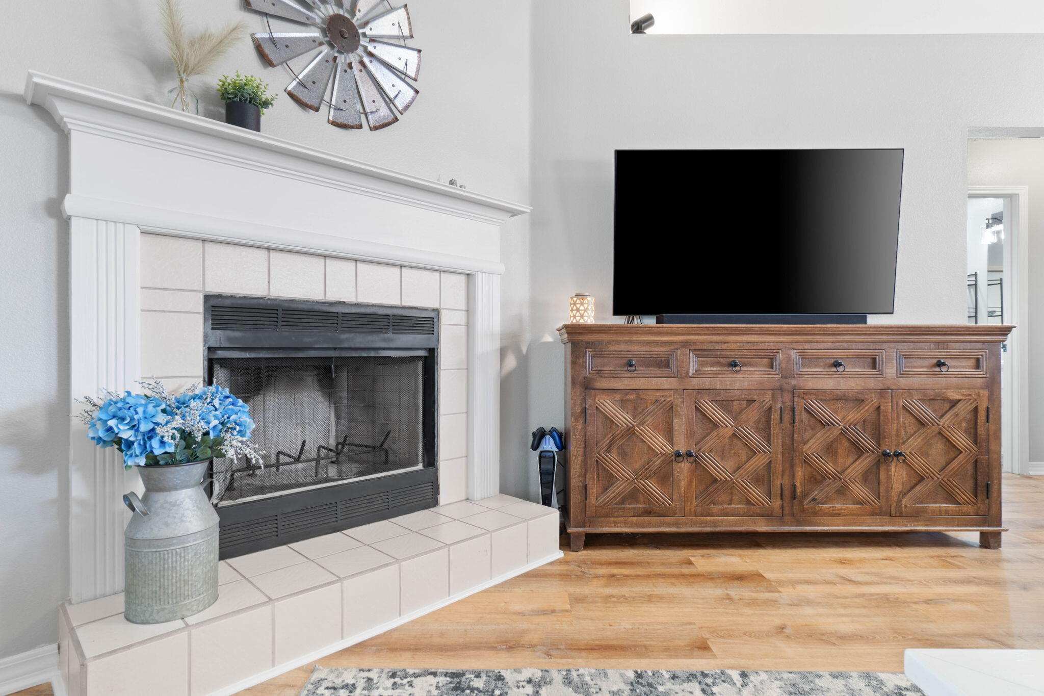 6779 Cedar Ridge Circle Milton, FL 32570 - Photo 11 of 46 a living room with a fireplace furniture and a flat screen tv