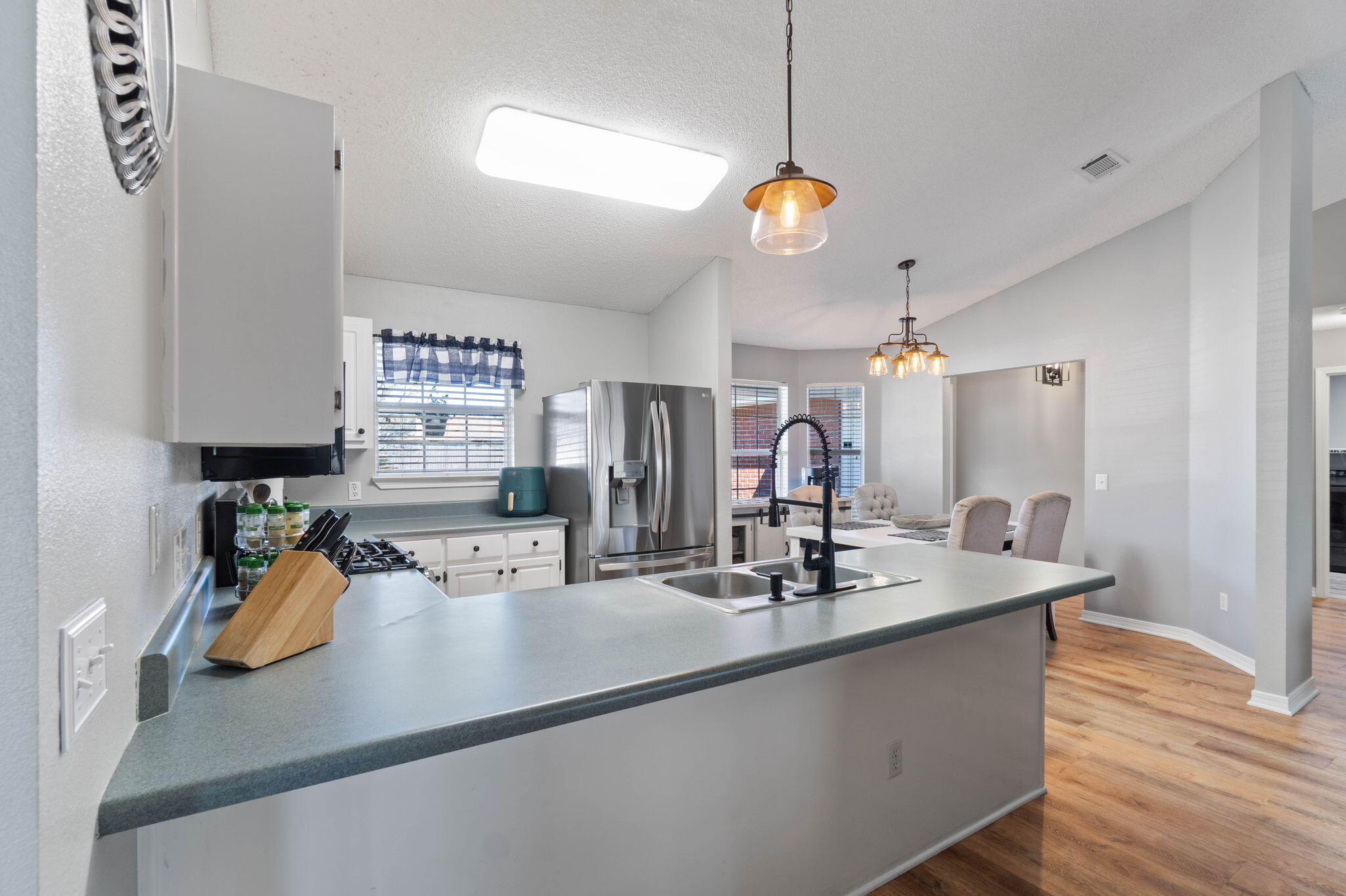 6779 Cedar Ridge Circle Milton, FL 32570 - Photo 12 of 46 a kitchen with a sink a counter space and stainless steel appliances