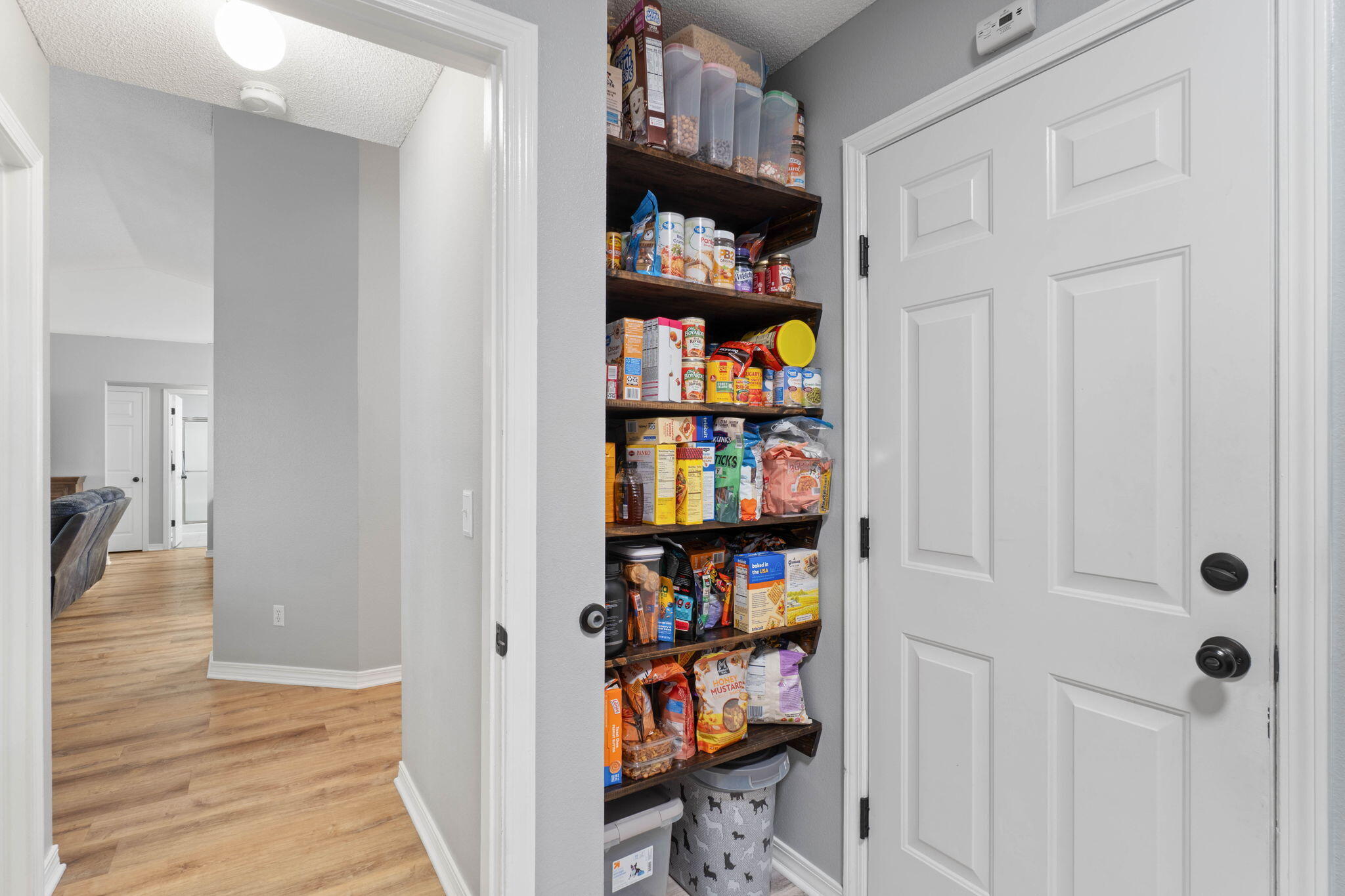 6779 Cedar Ridge Circle Milton, FL 32570 - Photo 19 of 46 a view of a hallway with wooden floor and closet