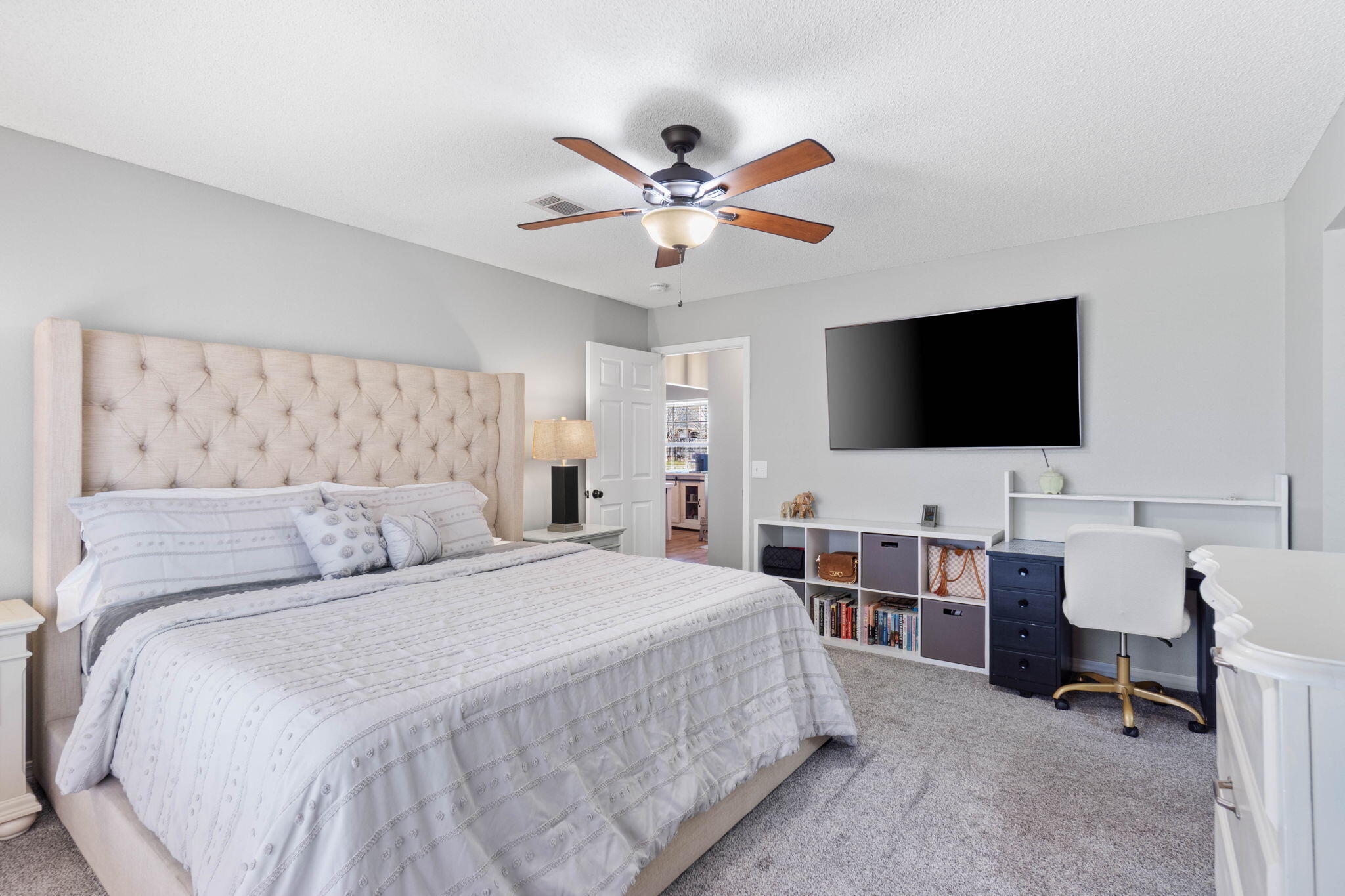 6779 Cedar Ridge Circle Milton, FL 32570 - Photo 20 of 46 a bedroom with a bed and a flat screen tv