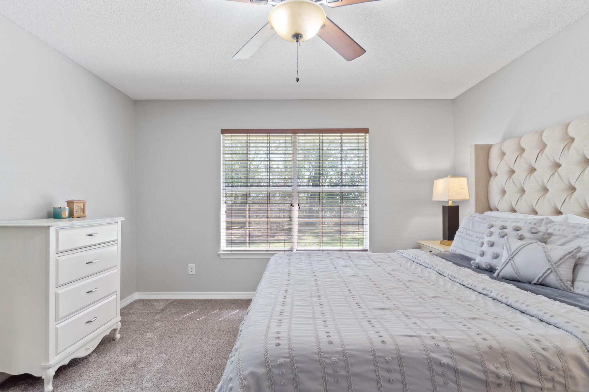 6779 Cedar Ridge Circle Milton, FL 32570 - Photo 21 of 46 a bedroom with a large bed and a window
