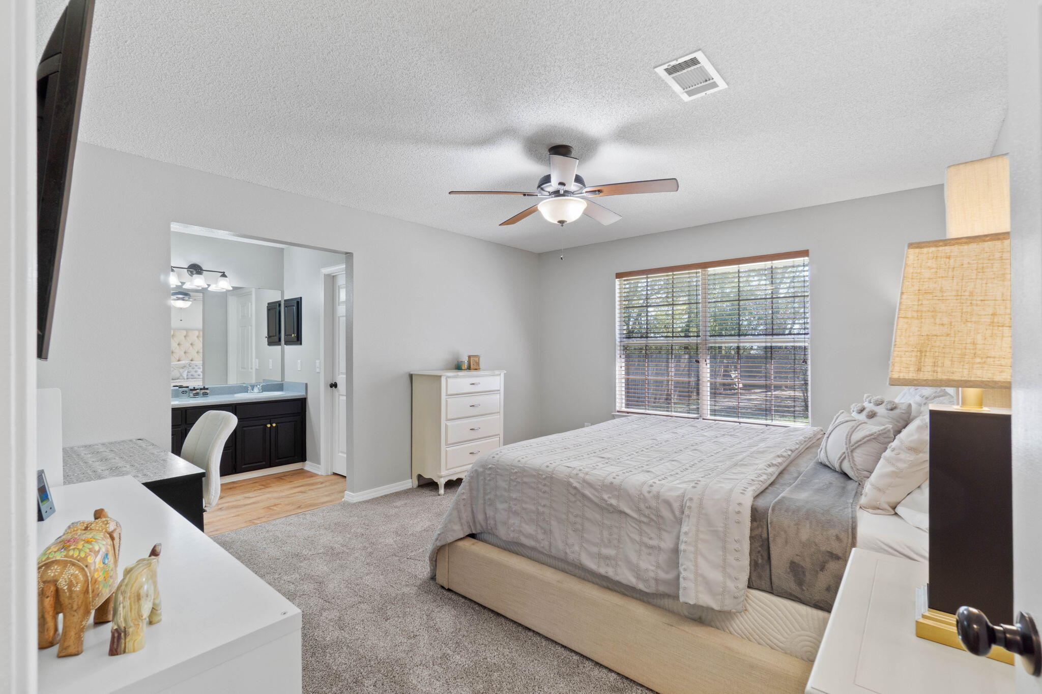 6779 Cedar Ridge Circle Milton, FL 32570 - Photo 22 of 46 a spacious bedroom with a bed and a couch